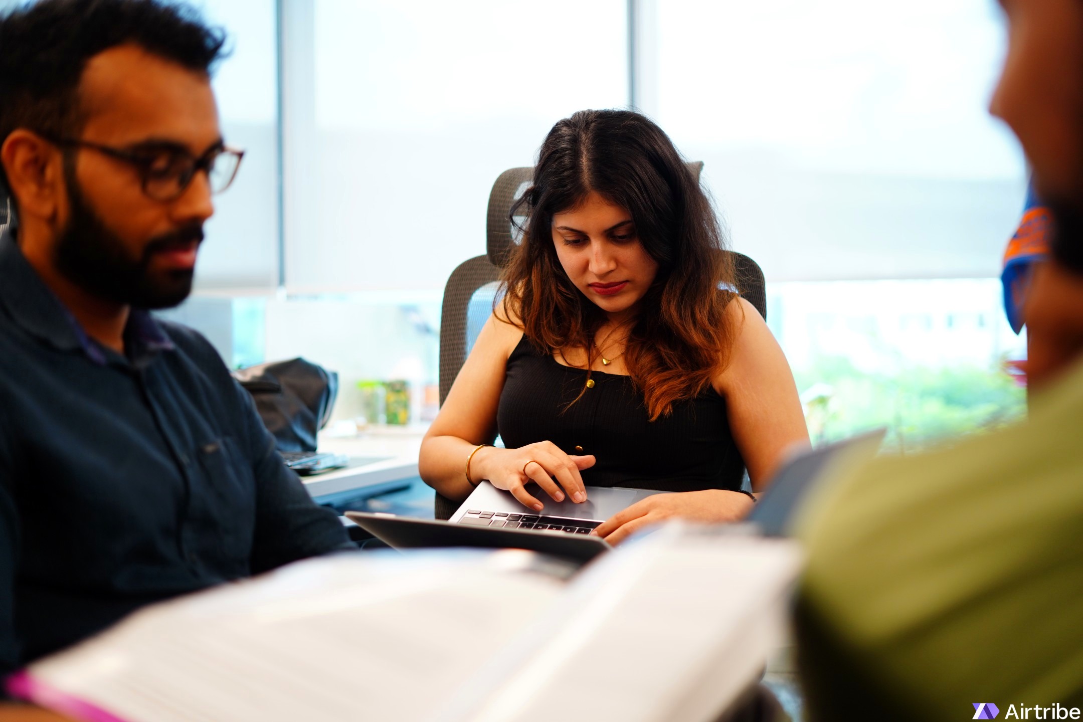 Latika working at her desk